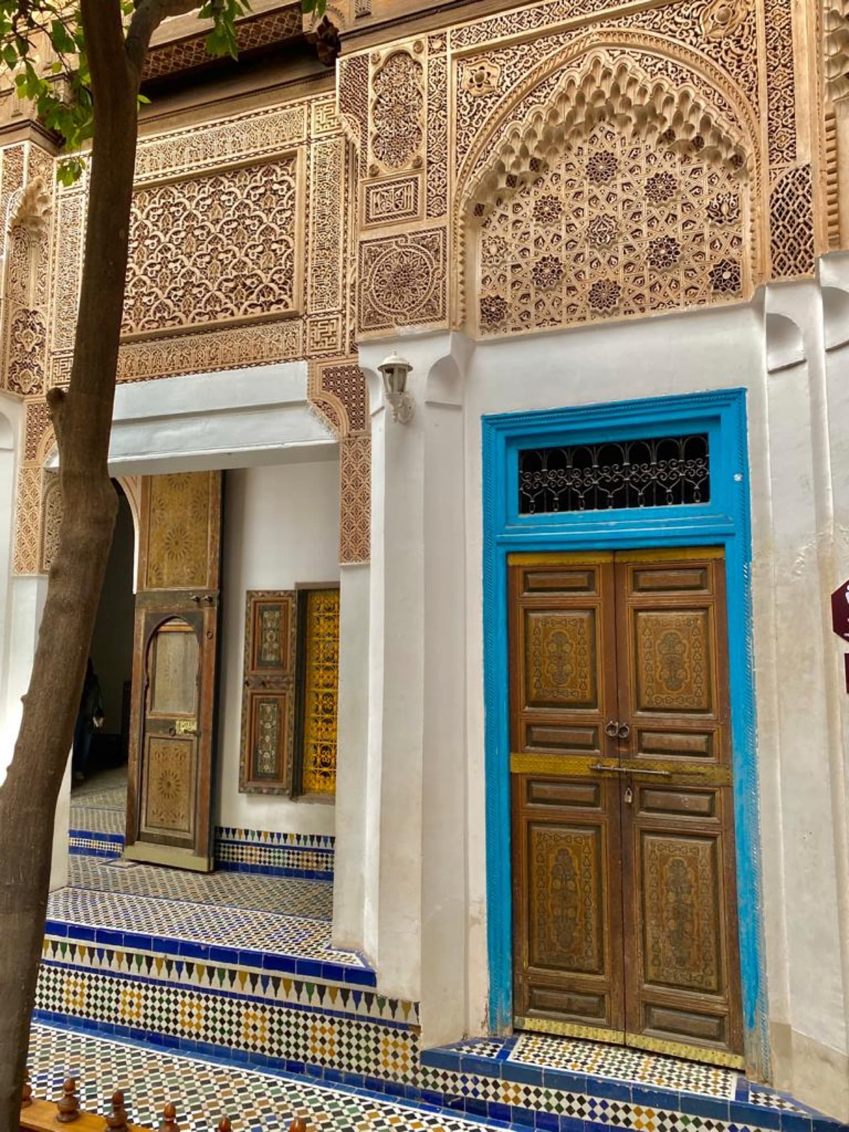 Carved plasterwork doorway in a Bahia Palace courtyard